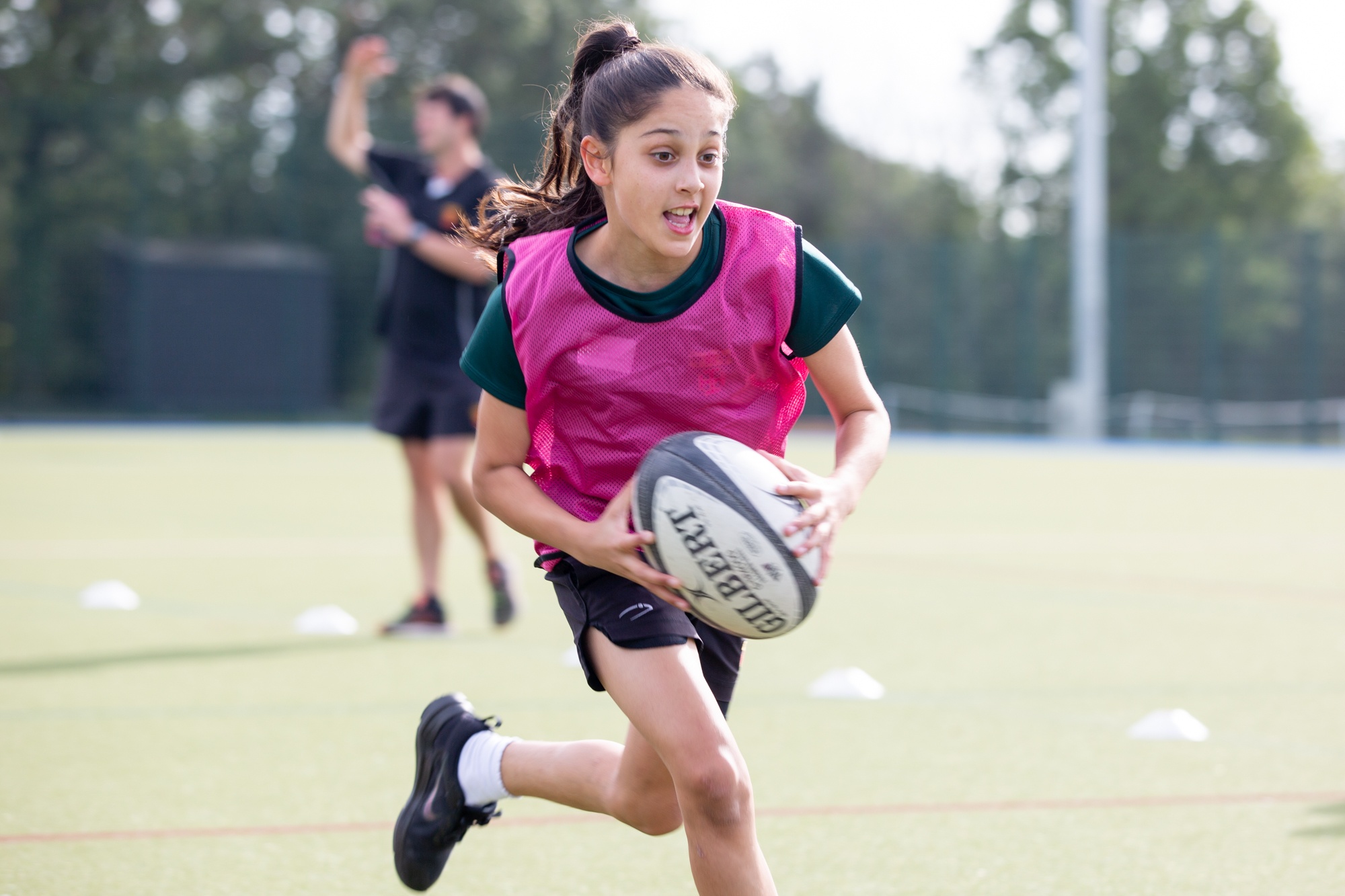 Girl playing rugby
