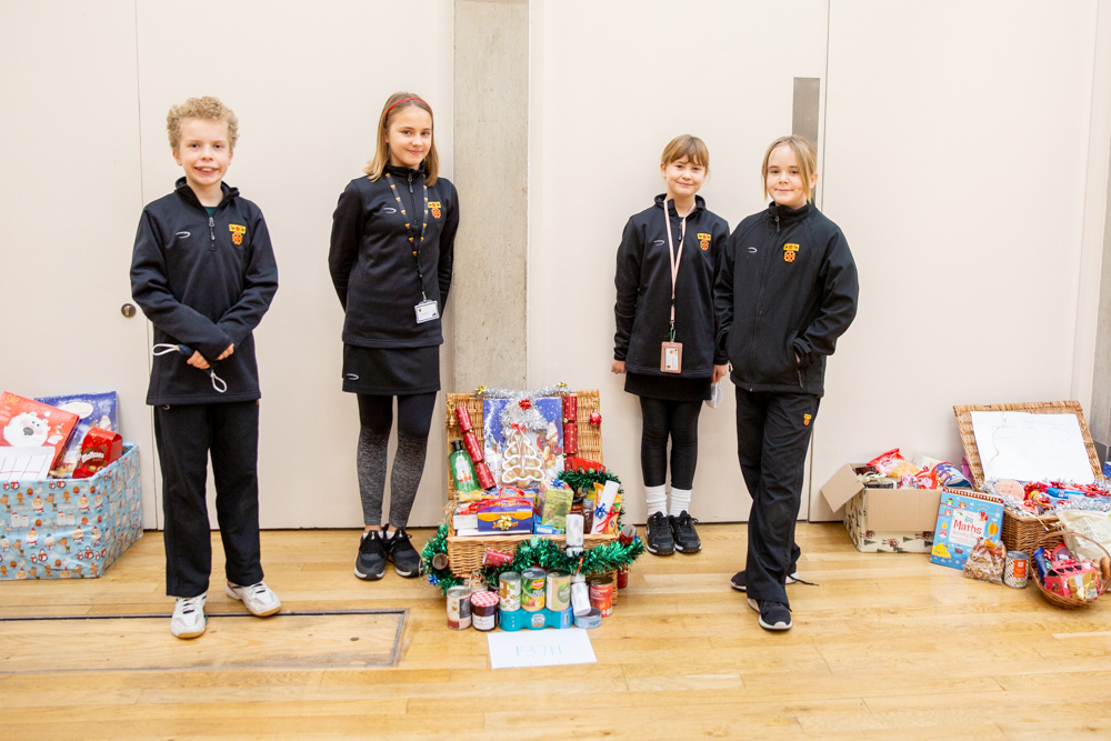 St Benedict's donates Christmas hampers to Ealing foodbank